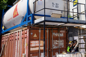  Filling the container with Sika Sigunit L-5401 AF sprayed concrete accelerator 