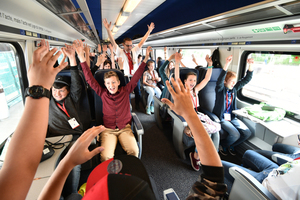  Passengers in one of the two first trains passing through the tunnel on the opening day | 