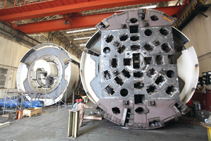  <div class="bildtext_en">Two of the six Robbins TBMs for China’s Liaoning NOW project are seen during shop assembly. Abrasion resistant wear plating is clearly visible on the top and bottom cutterhead pieces to aid in long distance excavation</div> 