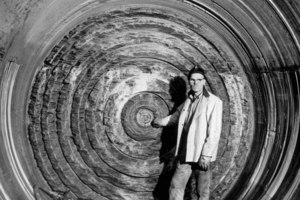  James S. Robbins stands in front of an early TBM excavation face showing kerf cutting 