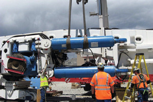  Crews load the TBM onto specialized transport dollies for final assembly in a launch chamber  