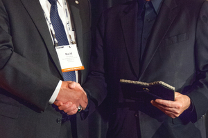  Past UCA of SME chair David Klug (left) presented the 2014 “Outstanding Individual” award to Robbins president Lok Home on behalf of the UCA of SME 