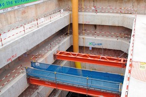  View inside the building pit in the direction of the bottom with reinforcements against the slotted walls of the KPE tunnel in Singapore 
